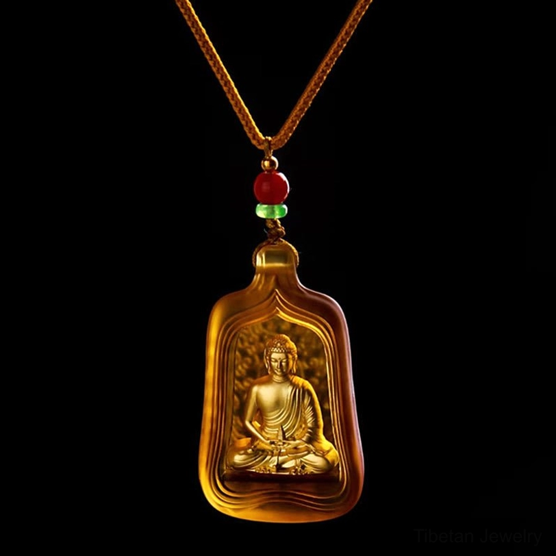 Yellow Medicine Buddha Liuli crystal pendant with golden Buddha figure on braided rope cord