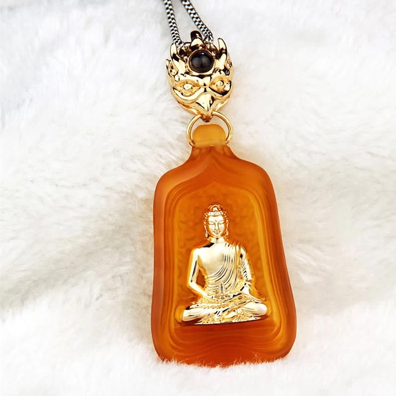 Yellow Medicine Buddha crystal pendant on silver metal chain with decorative clasp and bead