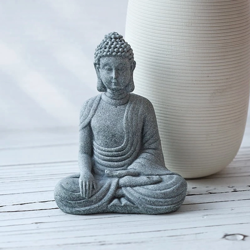 Meditating Buddha stone statue cross-legged seated form spiritual decor