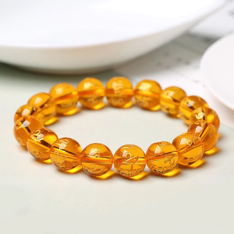 Meditation bracelet with om mani padme hum mantra showing daily wellness application for mindfulness practice