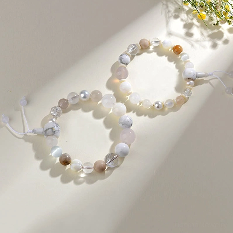 Two mini white agate pearl beaded bracelets - overhead close-up flat lay with small mixed gem beads, metal accents, and adjustable tassels