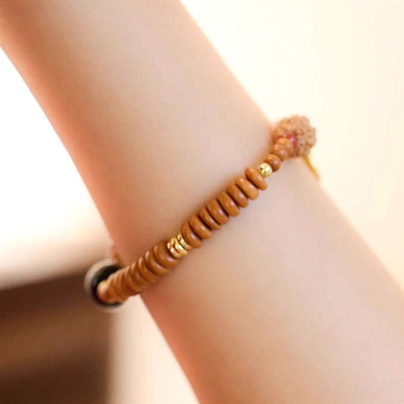 Minimalist tibetan bodhi seed bracelet single strand with black onyx, side wrist view