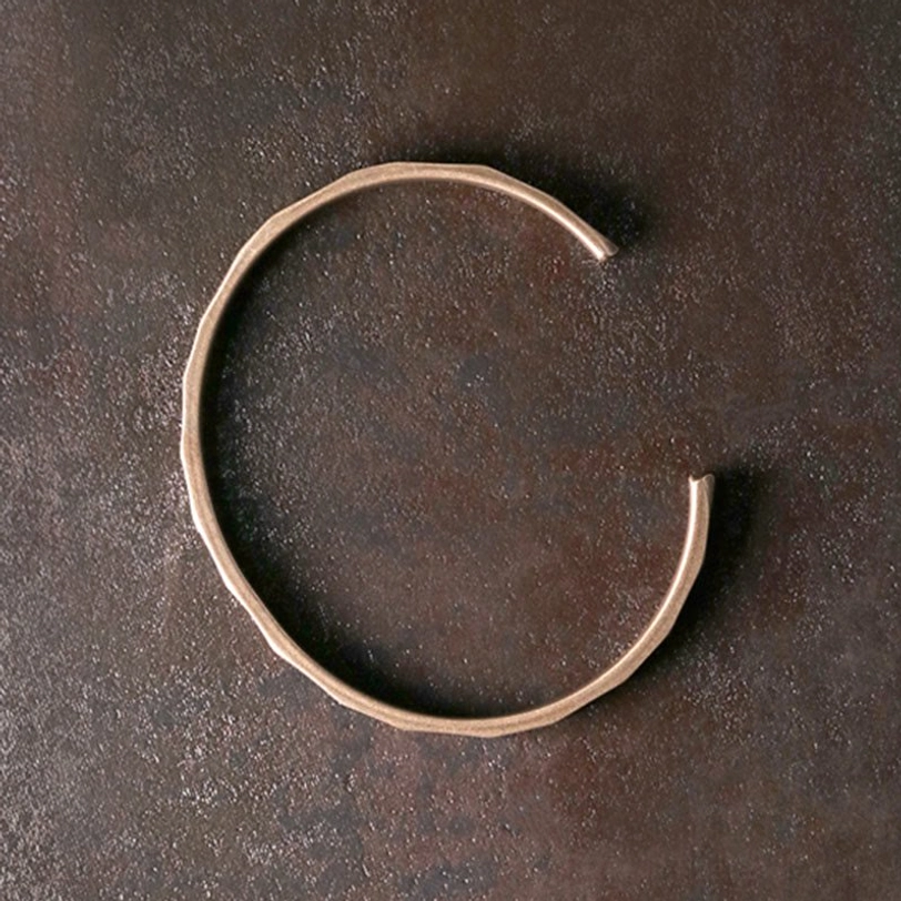 Minimalist copper open cuff bracelet smooth finish flat lay showing simple elegant design