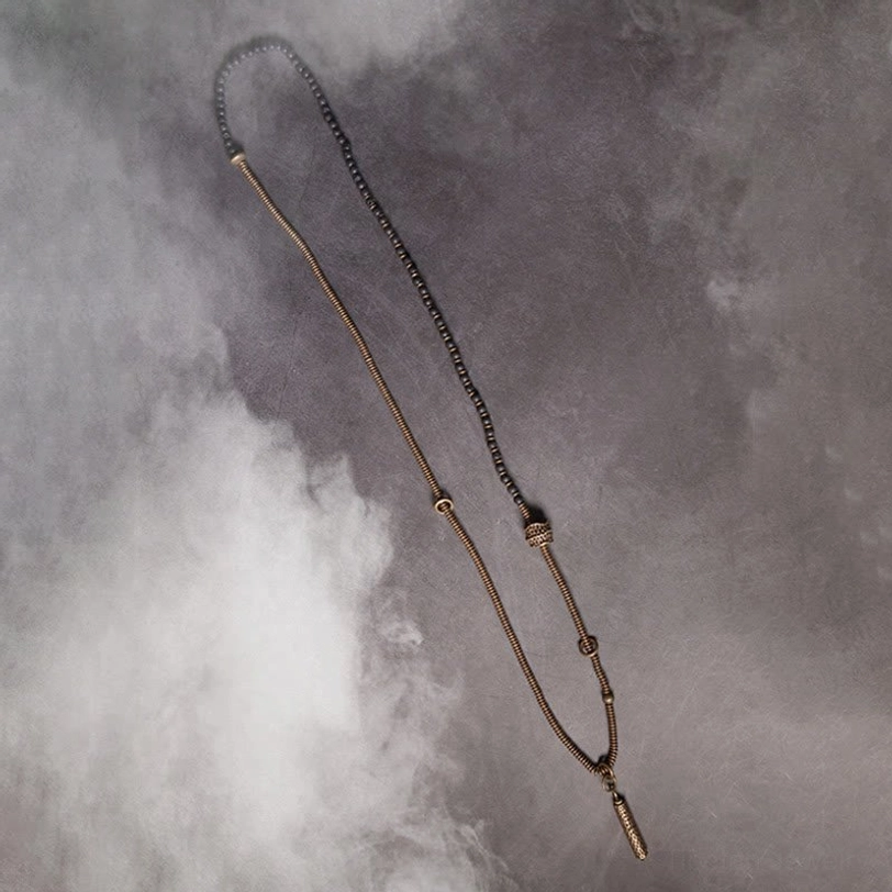 Minimalist layered lava rock and beaded cord bracelets with small tassel charm pendant