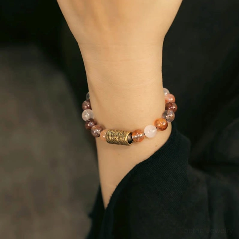 Multi-stone healing bracelet combining clear quartz, rutilated quartz, and phantom quartz beads together