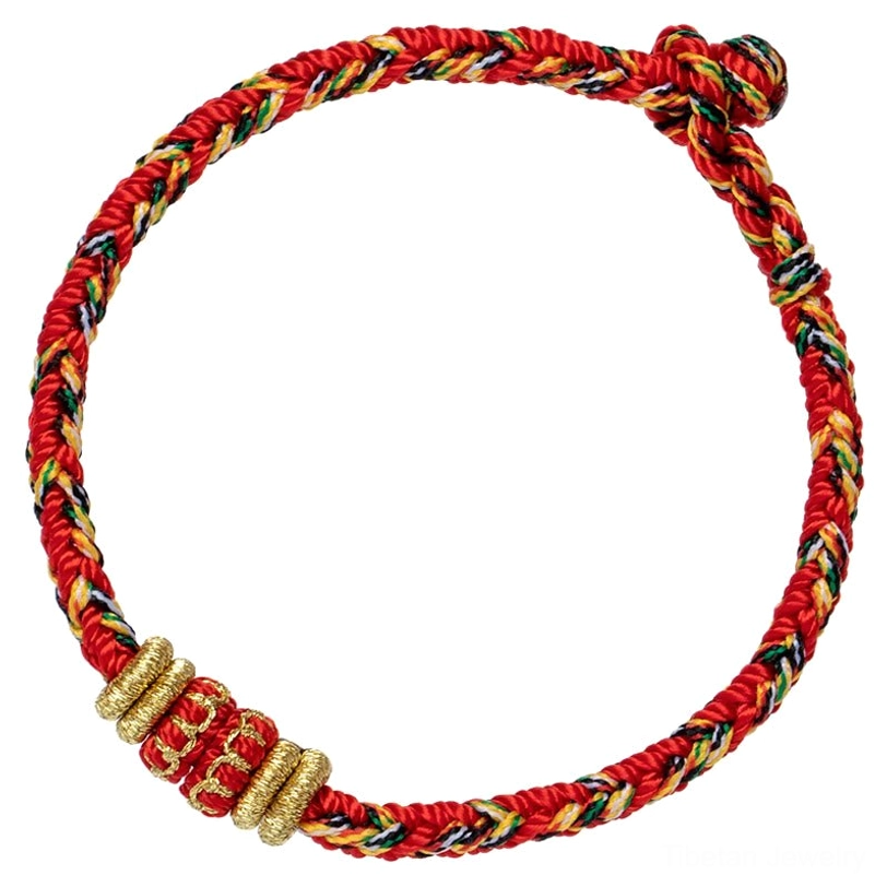 Natal Buddha zodiac bracelet showing traditional knot tying and cord blessing symbolism