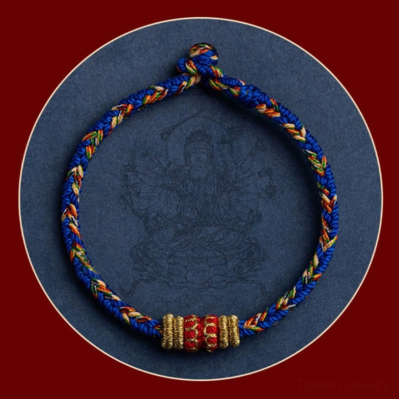 Natal Buddha zodiac bracelet close-up with red frame and Buddha engraving detail