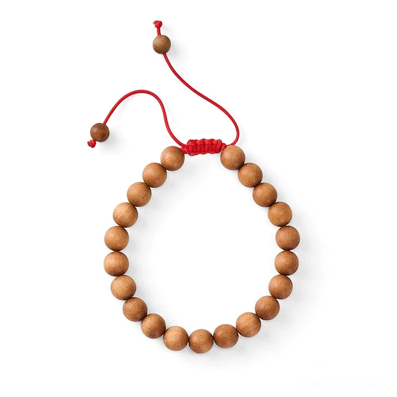 Natural sandalwood wrist mala prayer beads with adjustable red string, handcrafted spiritual jewelry for mindfulness
