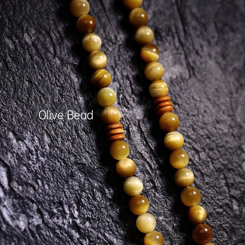 Natural Tiger Eye stone mala beads showcase warm golden-brown color and protective energy properties