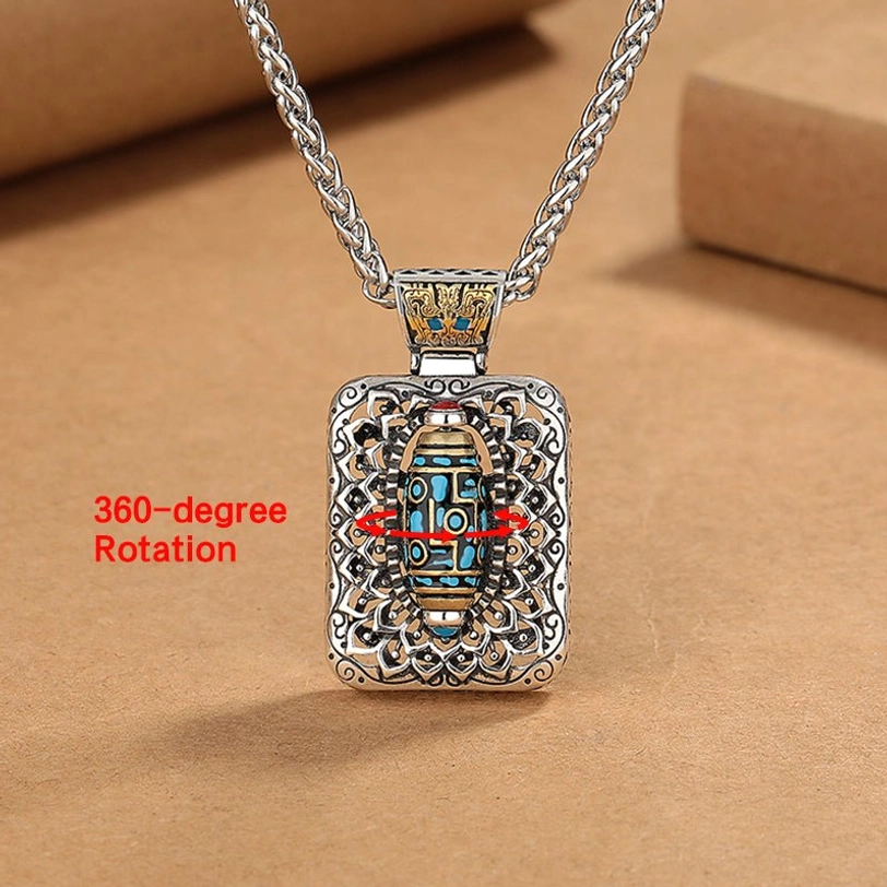 360-degree rotatable nine-eye dzi bead pendant showing complete rotation function and front flat view