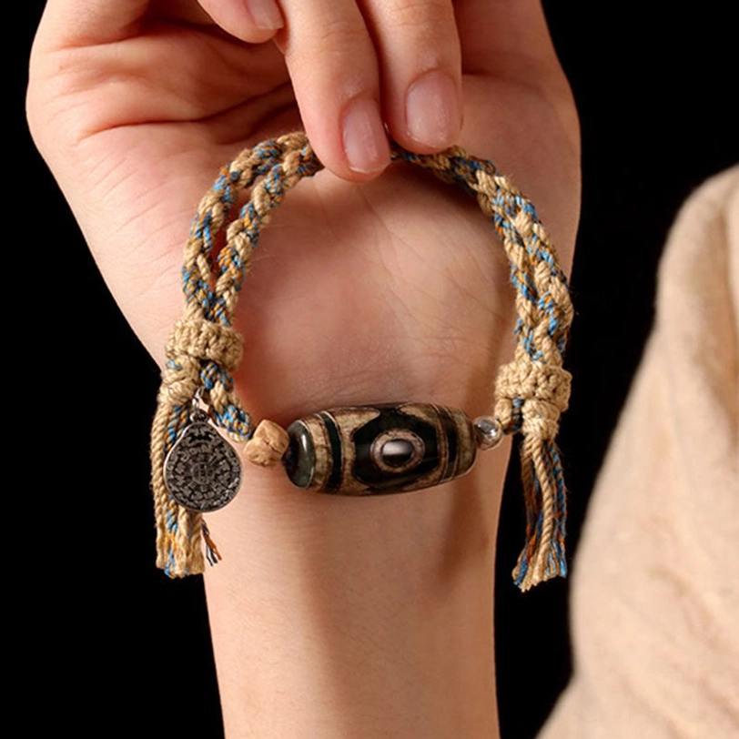 Nine-eye Tibetan Dzi bead protection and wealth attraction bracelet with sacred amulet stone and handcrafted braided rope