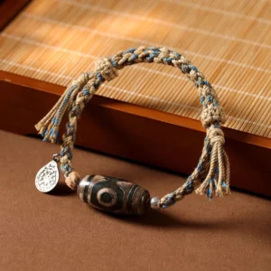 Nine-eye dzi bead bracelet handmade tibetan authentic braided rope with silver pendant top view