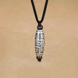 Nine-eye dzi bead copper pendant necklace front view with auspicious cloud motifs on aged silver tone metal