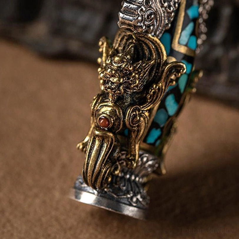 Tibetan nine-eye dzi Buddha turquoise necklace pendant authentic handcrafted artisan piece with spiritual symbolism and protective amulet design