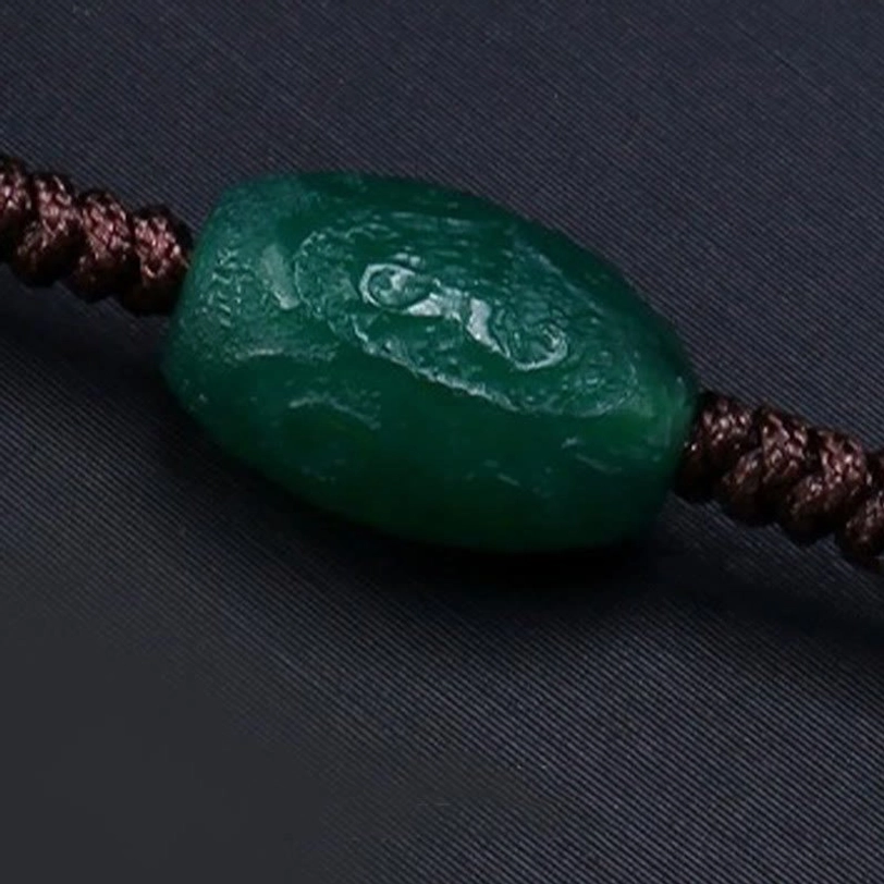 Nine-eye dzi protection necklace braided rope detail showing traditional tibetan weaving technique