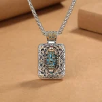 Nine-eye Dzi bead square pendant necklace with intricate filigree silver frame and inlaid Tibetan dzi stone