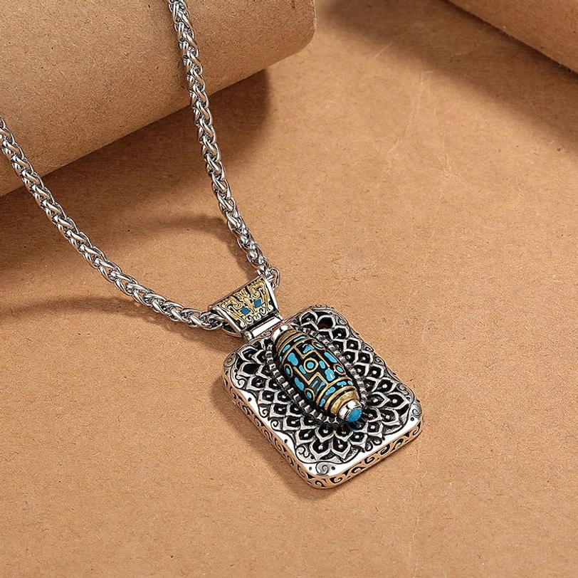 Rotatable nine-eye dzi pendant showing 360-degree rotation mechanism with vintage copper metal finish
