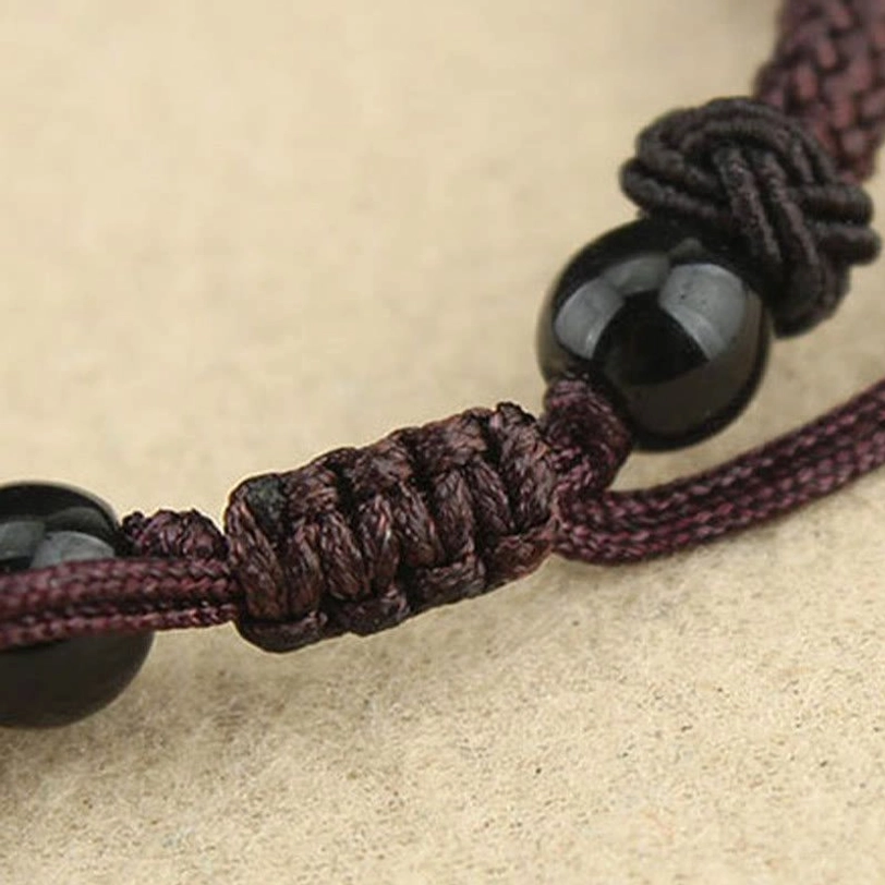 Nine-eye and three-eye dzi bead necklaces side-by-side comparison highlighting differences between protection pendant styles