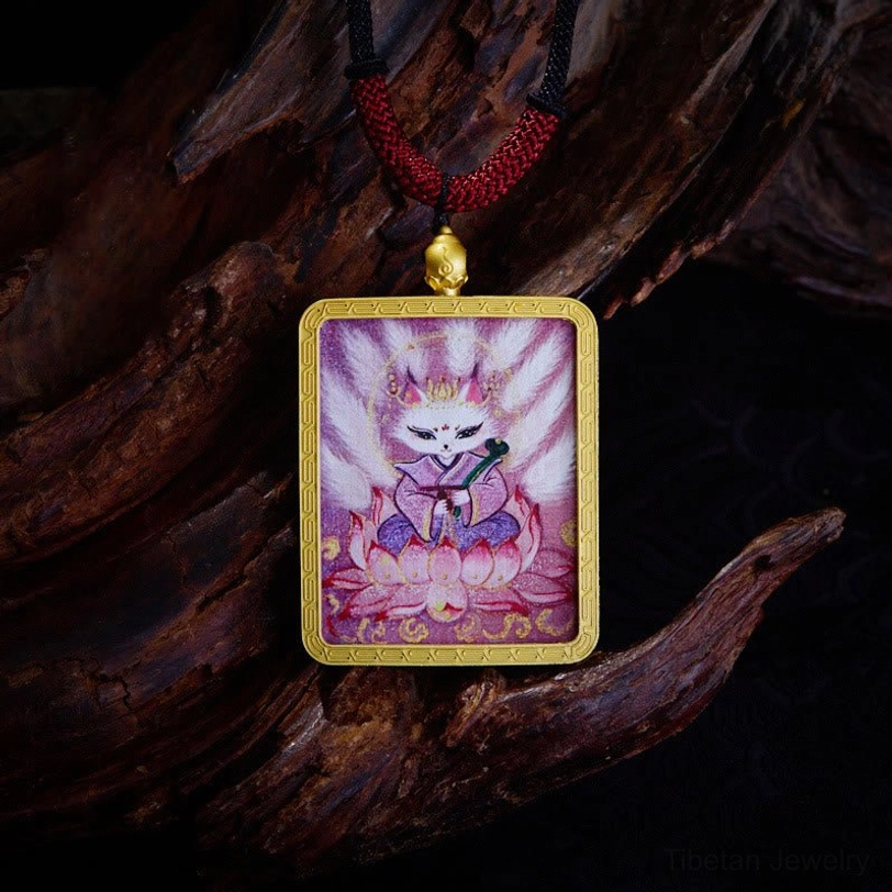 Nine-Tailed Fox thangka pendant with pink fox deity on lotus flower design, gold metal frame with red woven cord necklace