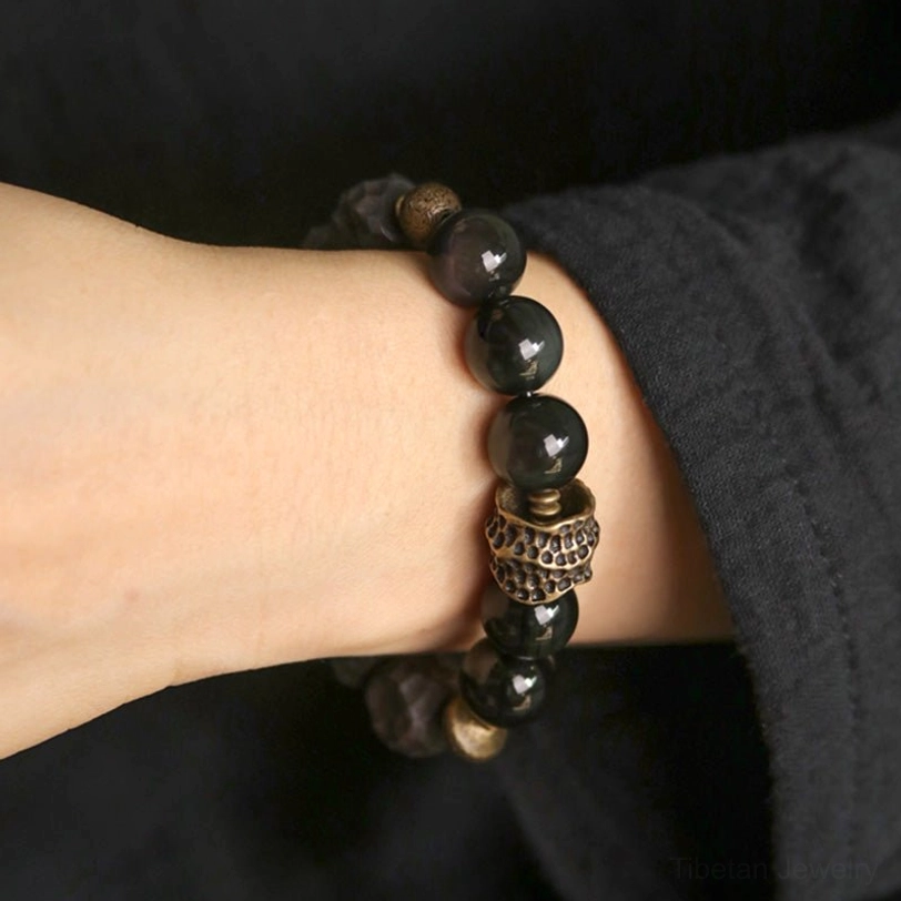 Full black obsidian ebony copper bracelet set displayed on wrist showing complete bead arrangement and proportion