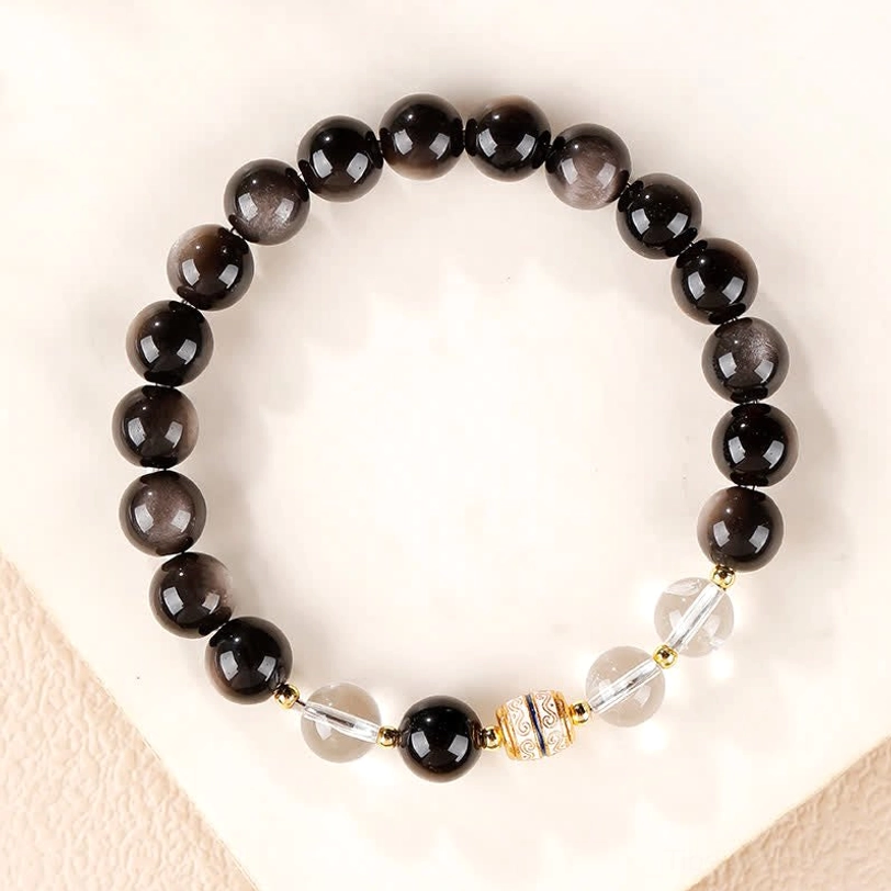 Silver Sheen Obsidian Dzi Bead Bracelet flat lay unclasped showing full circular design