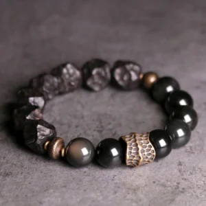 Black obsidian ebony wood copper couple bracelet flat lay overhead view showing mixed beads and vintage copper accents
