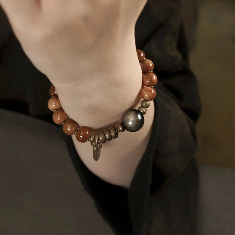 Gold sheen obsidian stone bracelet with kuka seeds elegant wrist presentation