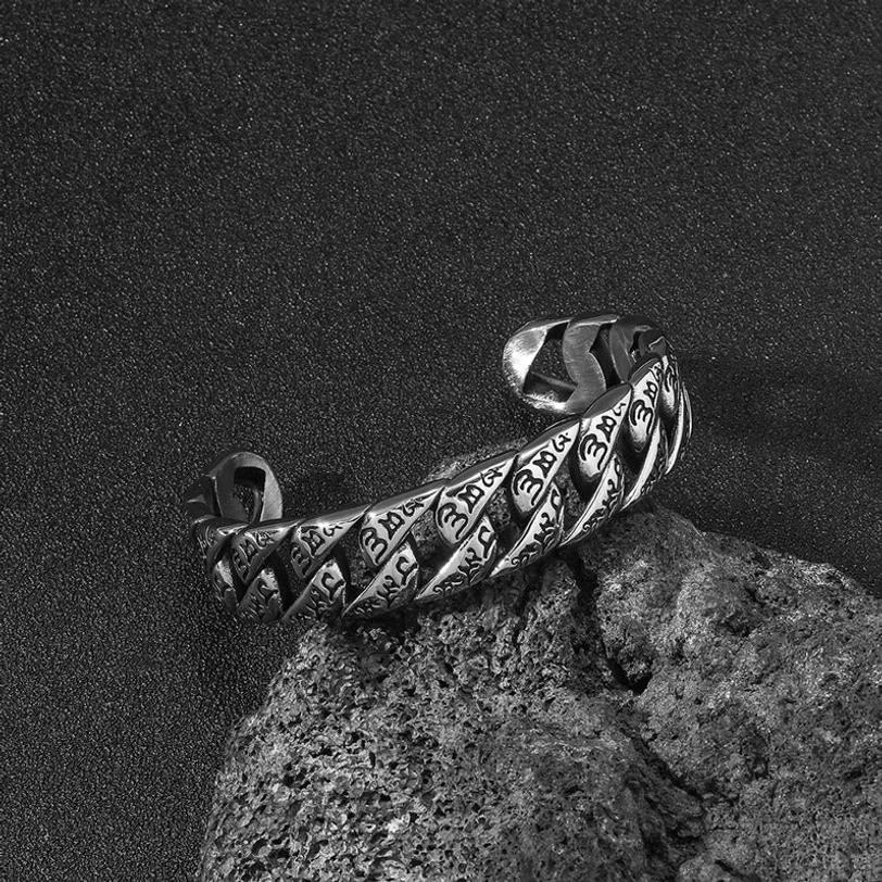 Om Mani Padme Hum engraved titanium steel bracelet with antique silver finish, low side angle showing open cuff design