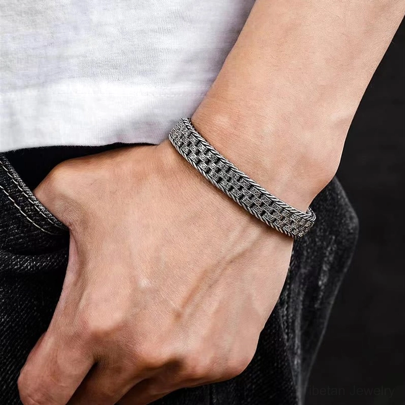 Casual daily styling of the Om Mani Padme Hum copper bracelet worn on the wrist with contemporary clothing, showing versatile everyday wear aesthetic