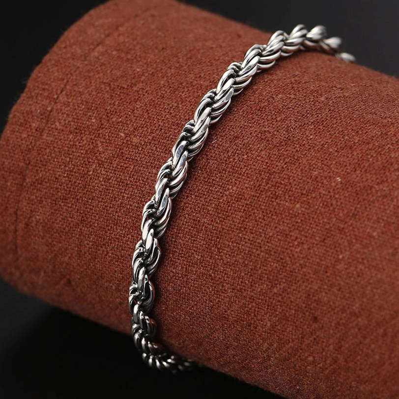 Detailed view of twisted sterling silver rope texture on Om Mani Padme Hum Double Dorje bracelet