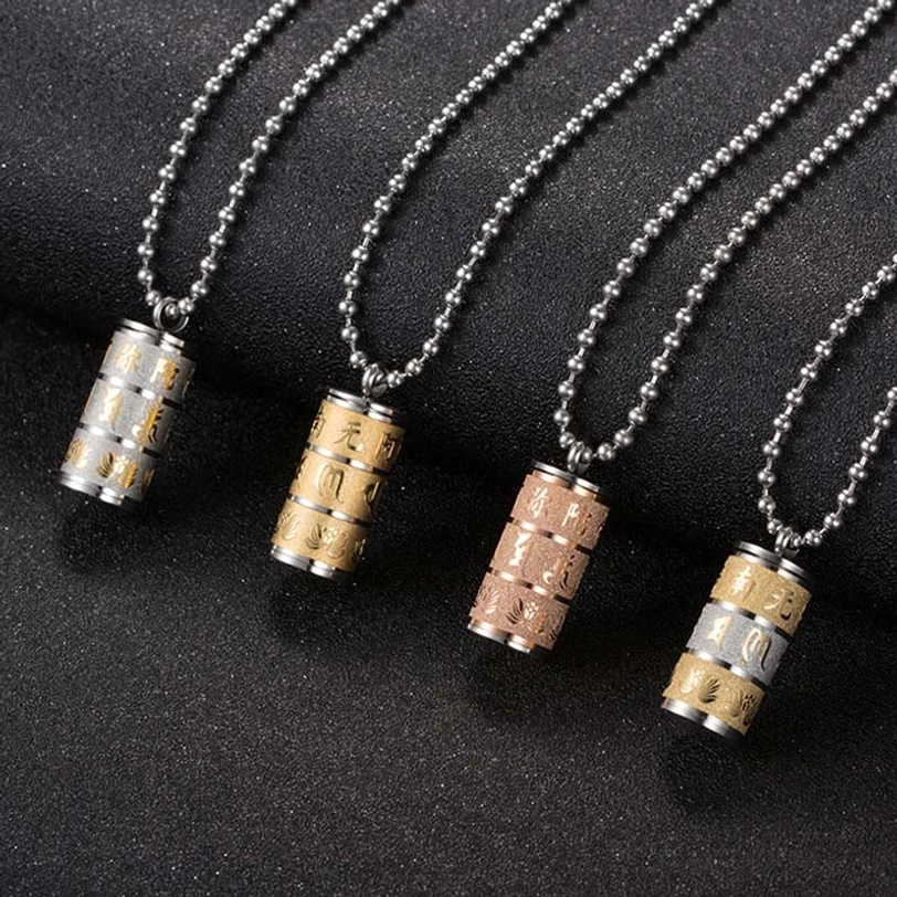 Tibetan lotus and Om Mani Padme Hum necklace pendant detail shot showing engraved Buddhist symbols
