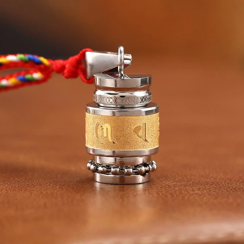 Single Om Mani Padme Hum pendant with beaded decorative trim and red woven colorful rope lanyard