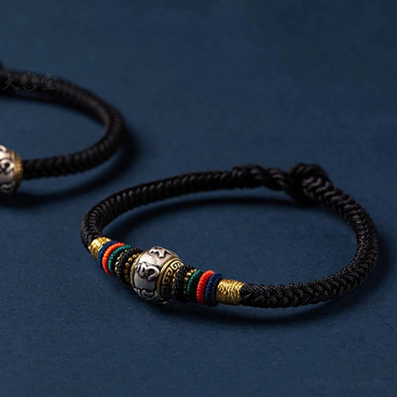 Om Mani Padme Hum Tibetan bracelet with 925 sterling silver charm and adjustable braided rope