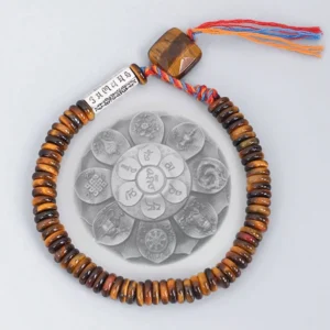 Om mani padme hum tibetan bracelet with square tiger eye pendant displayed on sacred mandala mat