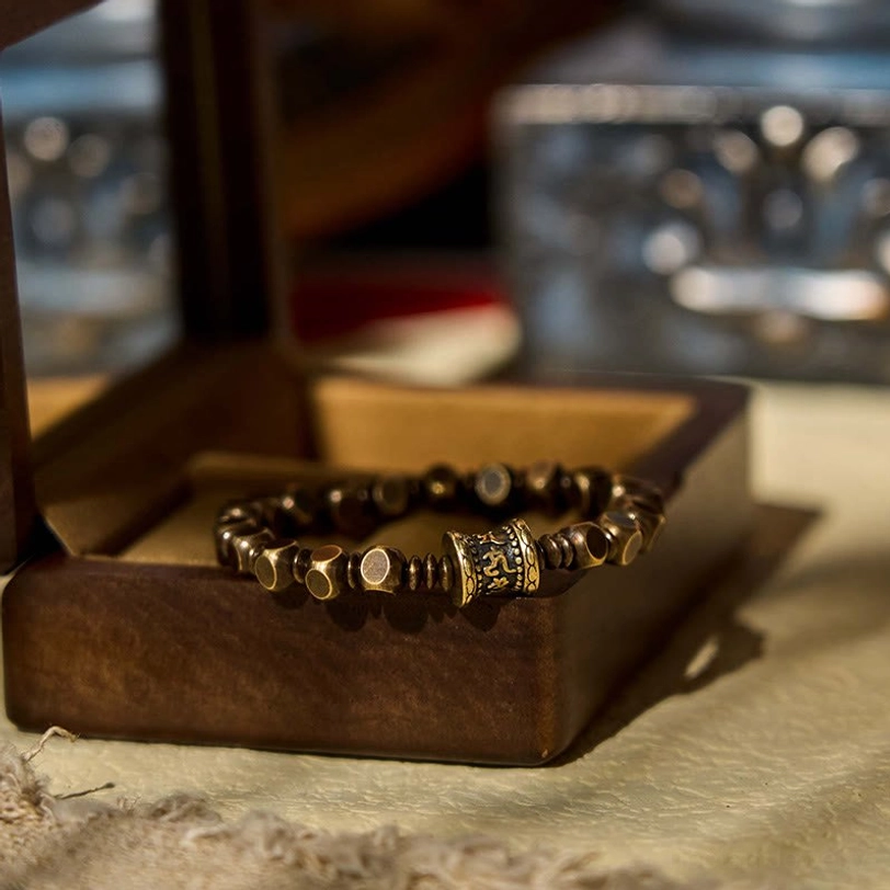 Tibetan amulet bracelet nestled in luxury gift box with soft velvet presentation