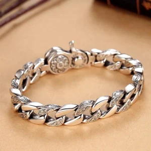 Sacred Six-Syllable mantra bracelet with double dorje vajra charm, side view showcasing curb chain detail and lobster clasp
