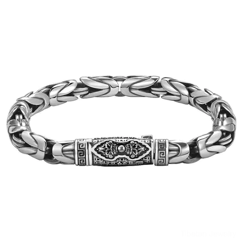 Om Mani Padme Hum copper bracelet full symmetrical overhead view showing dual engraved decorative bands and braided chain pattern