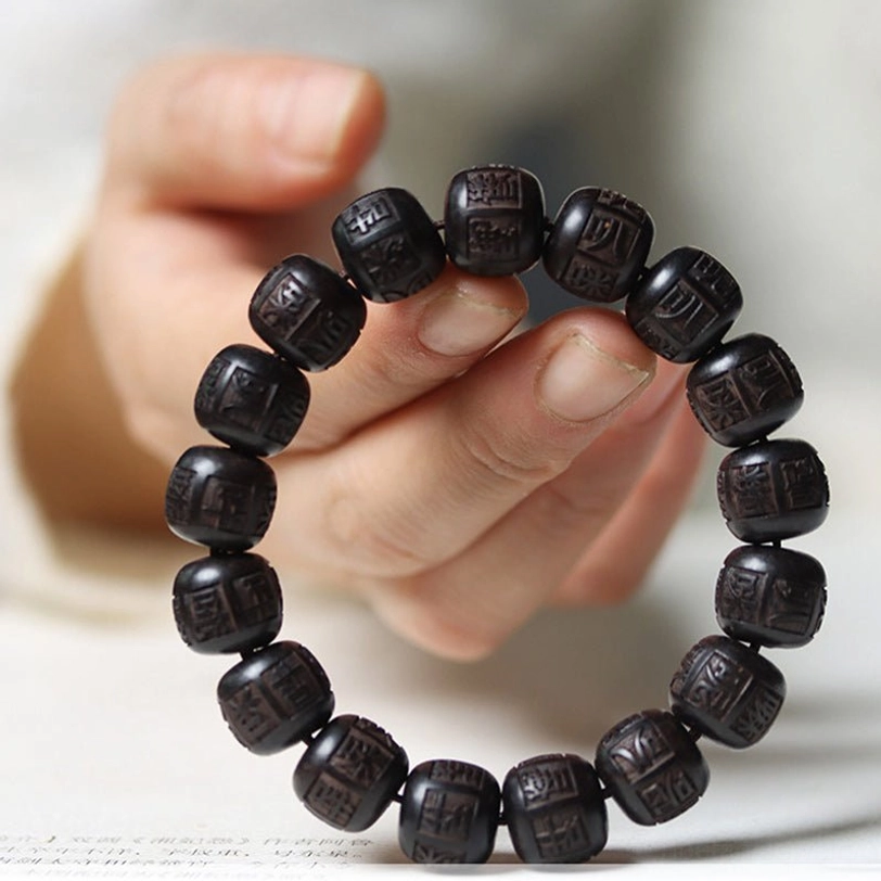 Sacred mantra bracelet worn on female wrist showing comfortable daily wear fit