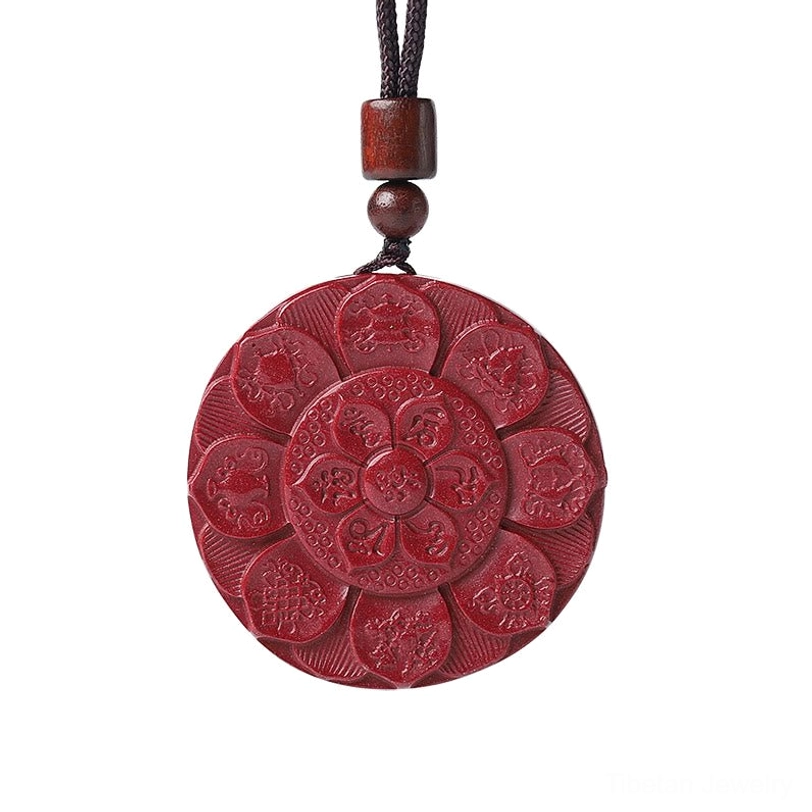 Om Mani Padme Hum Tibetan cinnabar pendant with lotus carving, brown wooden bead accents on dark background