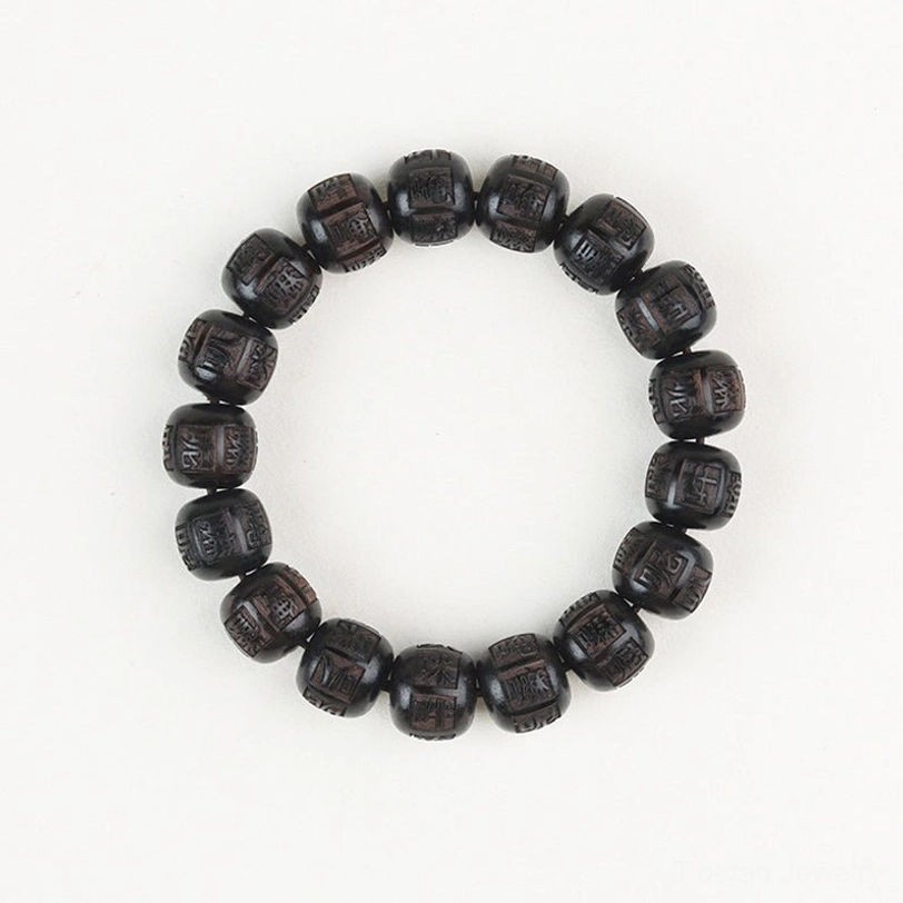 Complete circular view of handcrafted ebony wood mantra bracelet showing all carved beads