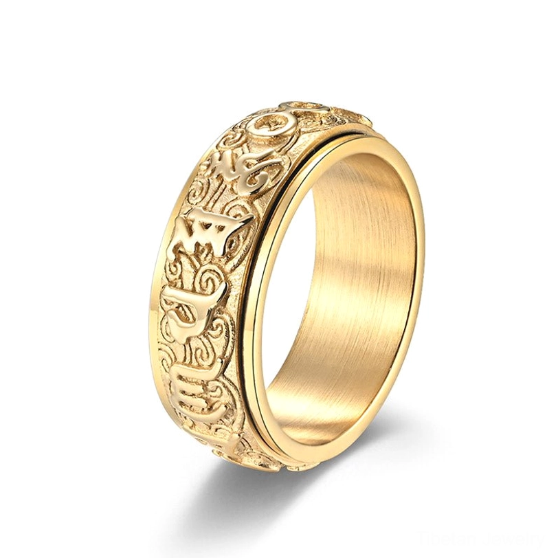 Full gold finish Om Mani Padme Hum spinner ring with intricate Sanskrit and scroll engravings on white background
