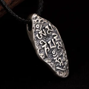 Sanskrit mantra engraving detail of Om Mani Padme Hum on 925 sterling silver Tibetan Buddhist pendant