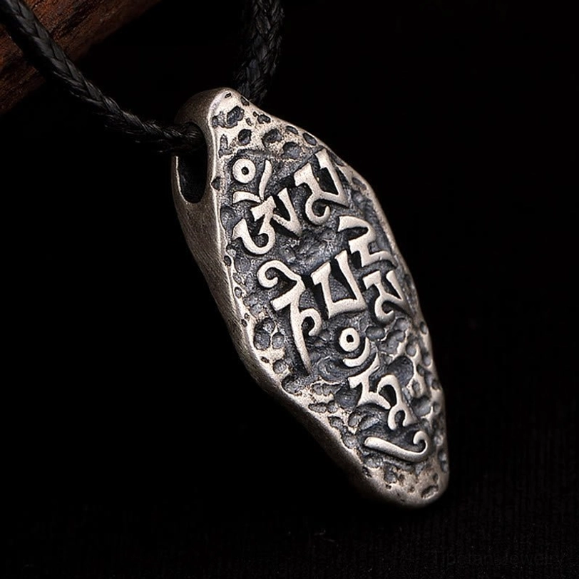 Sanskrit mantra engraving detail of Om Mani Padme Hum on 925 sterling silver Tibetan Buddhist pendant