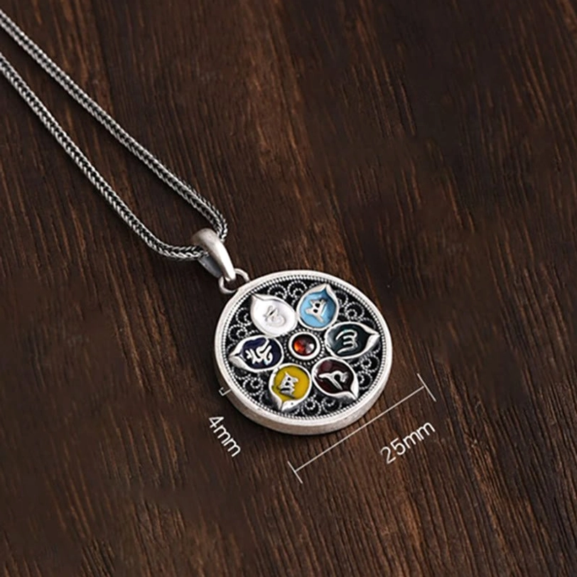 Om Mani Padme Hum pendant necklace with size markings (25mm x 4mm) attached snake chain on wooden surface