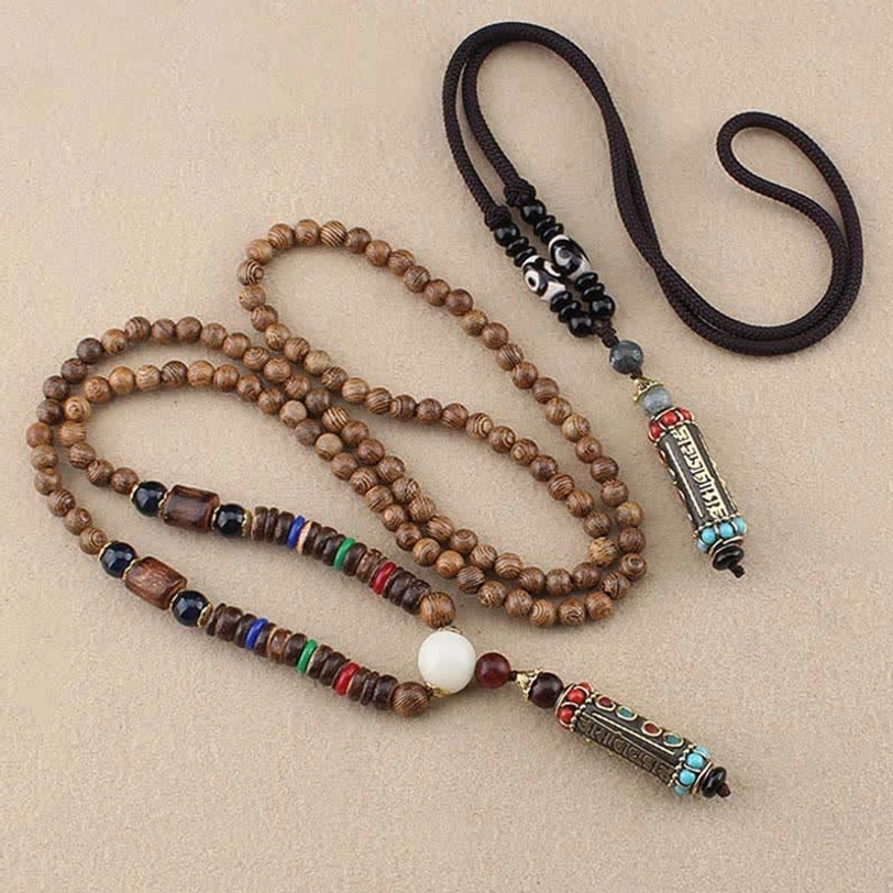 Two Tibetan mantra necklaces side by side - beaded chain style and simple cord pendant style
