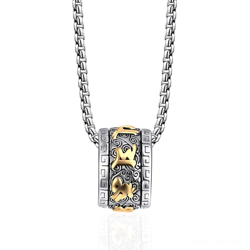 Om Mani Padme Hum titanium steel rotating necklace pendant with two-tone silver and gold finish, front overhead view on white background
