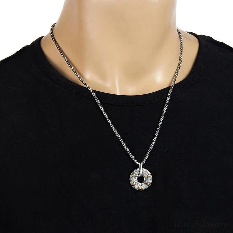 Om Mani Padme Hum tibetan mantra necklace worn on display mannequin showing dainty thin chain and pendant at collarbone