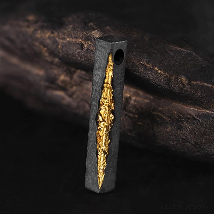Om Mani Padme Hum sterling silver and gold pendant close-up with mantra carving detail