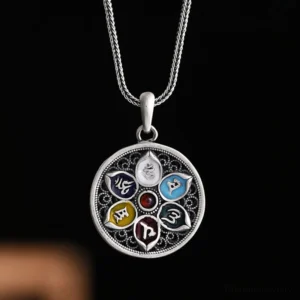 Om Mani Padme Hum silver pendant necklace with filigree hollow design and enamel colored mantra patterns on dark background