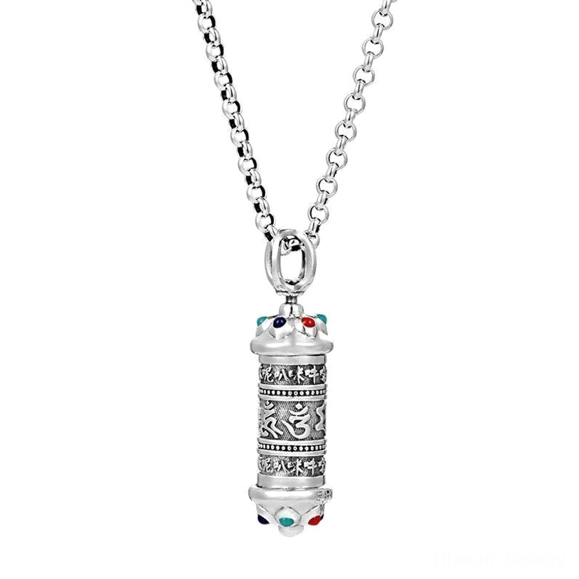 Om Mani Padme Hum silver pendant with gemstone accents on light gray background, clear front view of mantra engravings